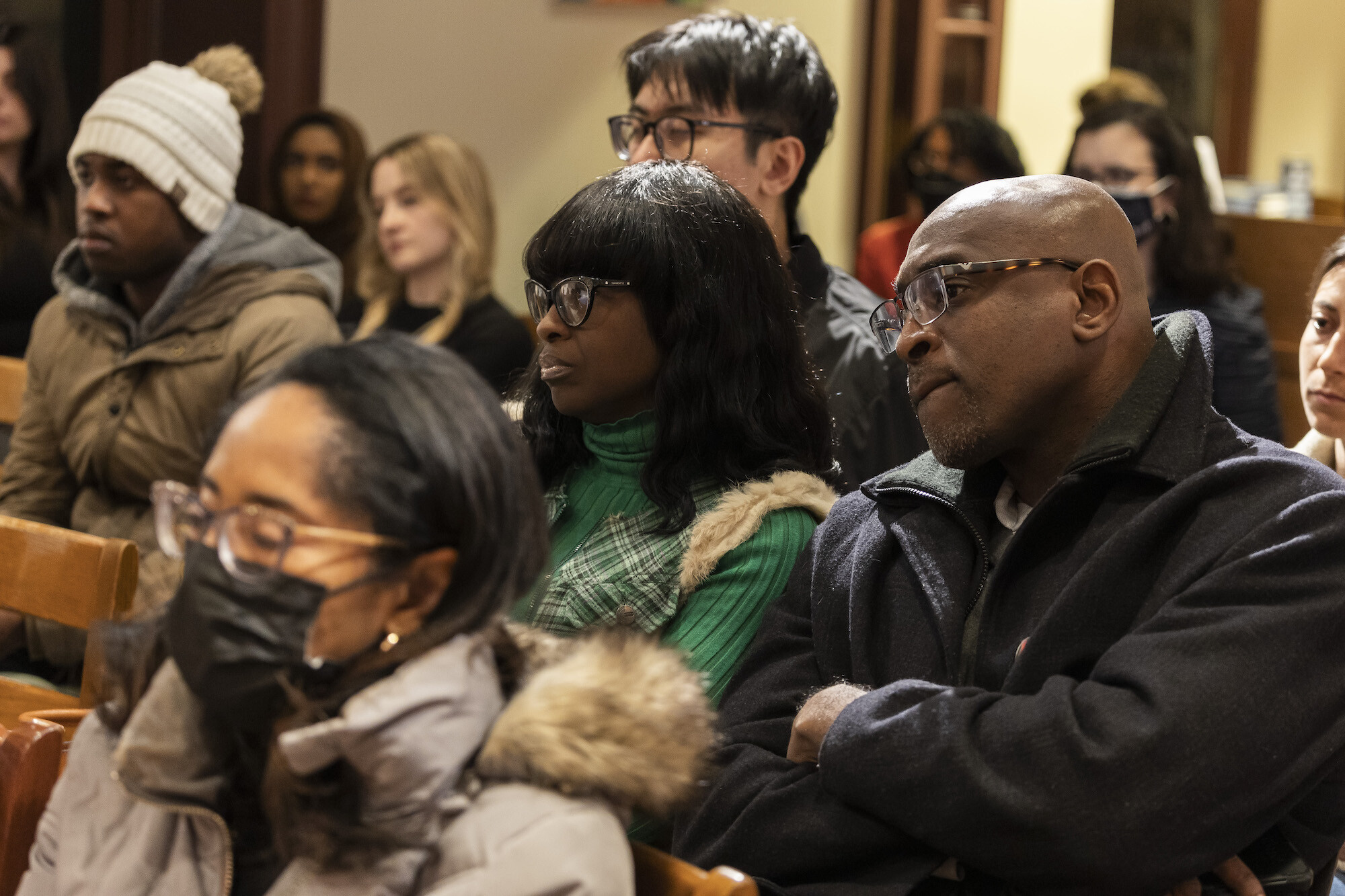 Audience members listening during a book talk