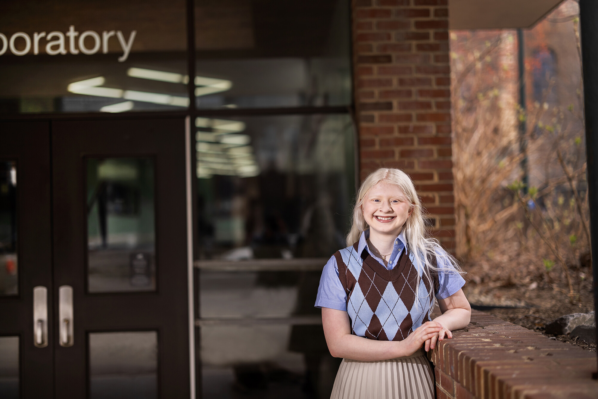 Sarah Kane stands outside the the entrance of David Rittenhouse Laboratories