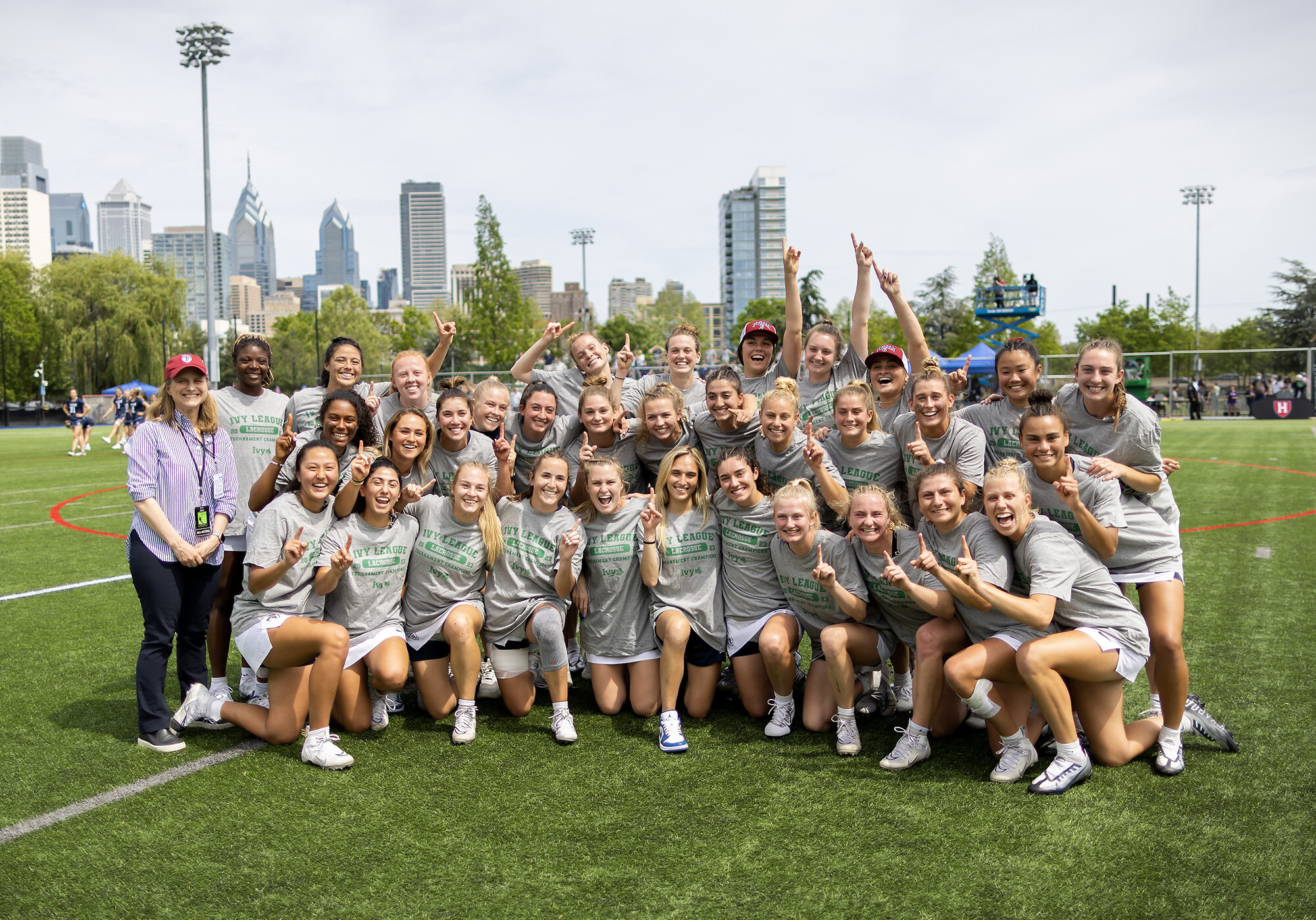 upenn women's lacrosse 2023 champs posed with President Liz Magill