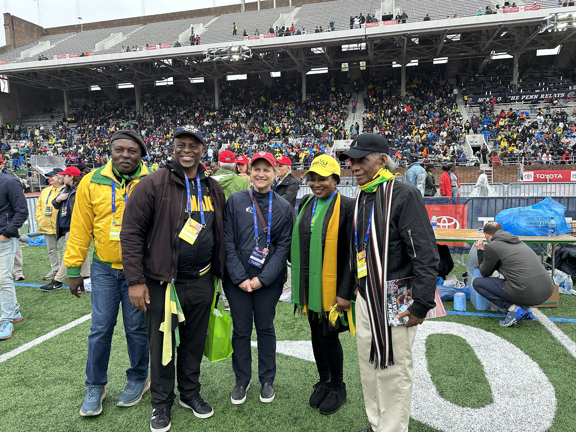 President Liz Magill (red hat) poses with Alsion Roach Wilson (yellow hat), the Consulate General of Jamaica, New York.