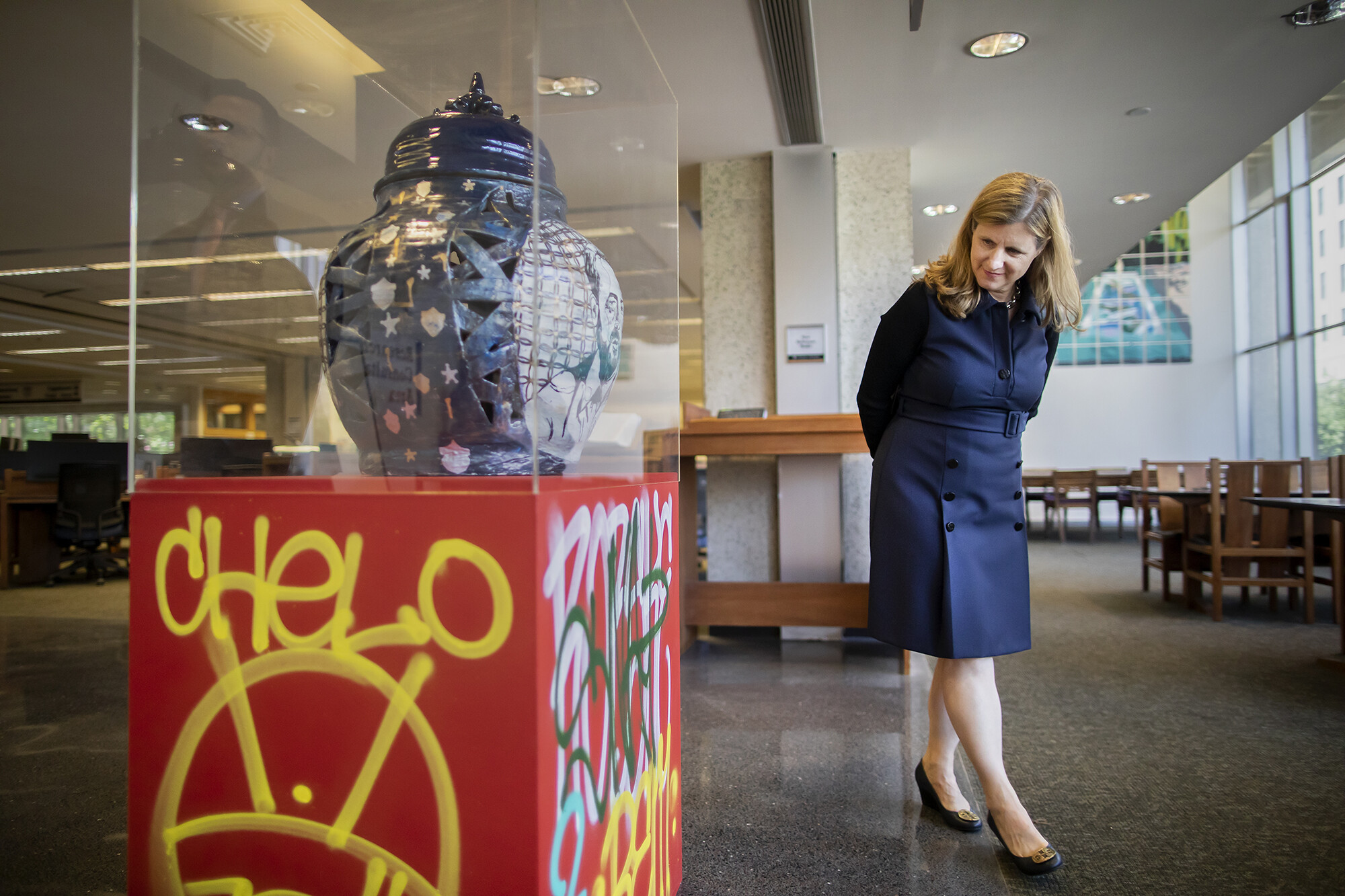 Penn President Liz Magill looks at the artwork “Bridges” by Robert Lugo in the ARthur Ross Gallery.