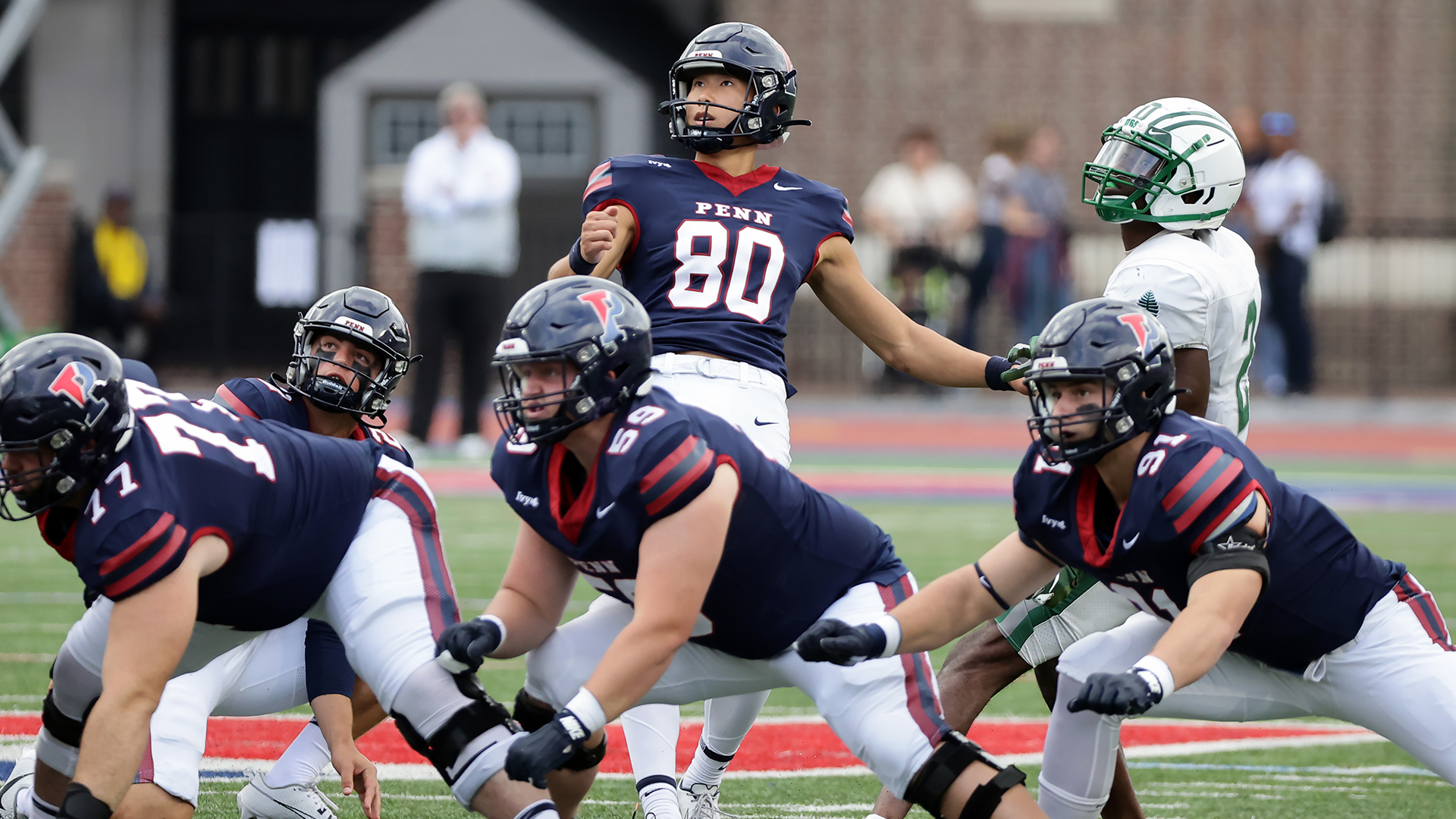 Albert Jang looks at his kick as it sails toward the goalposts against Dartmouth.