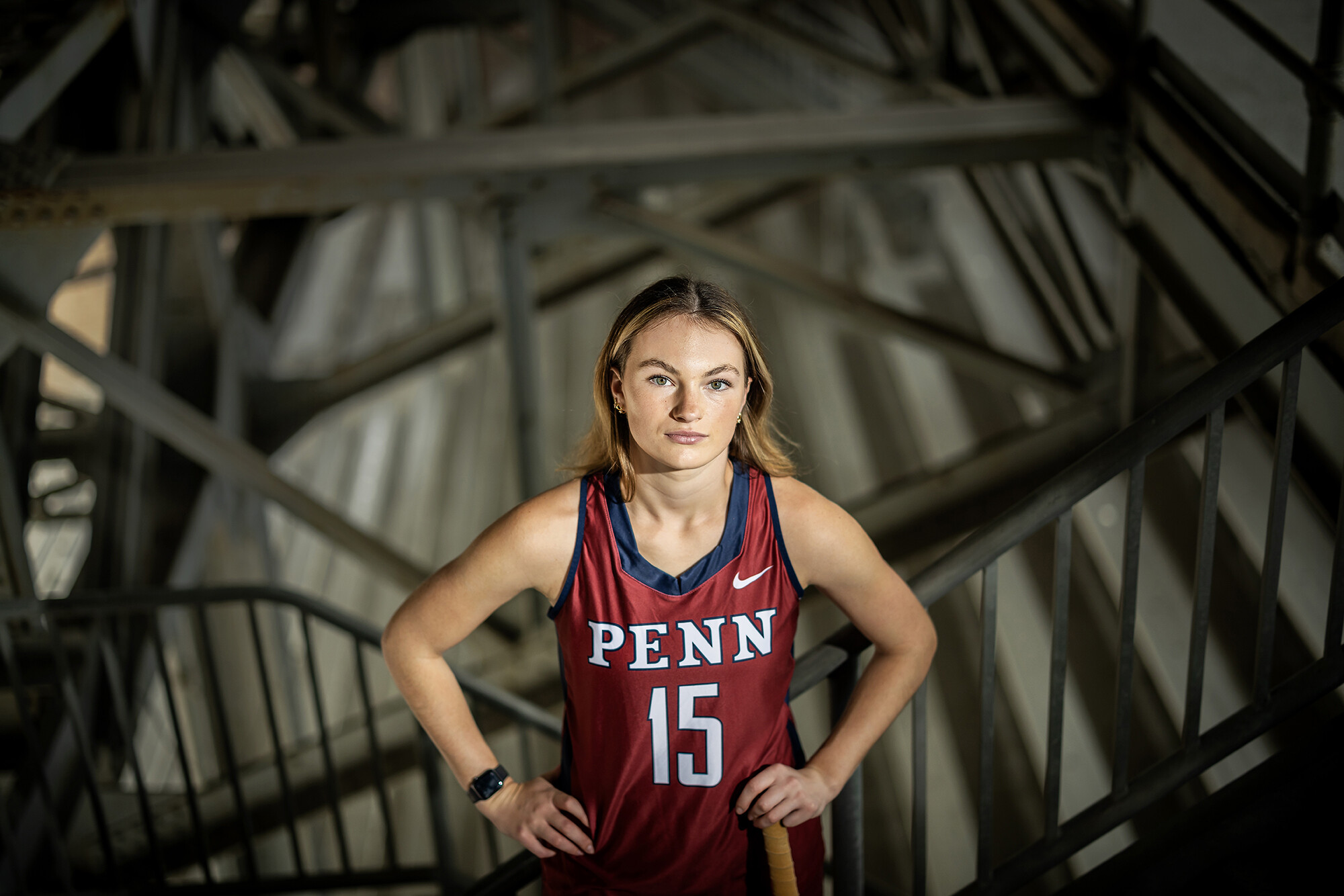 Allison Kuzyk poses with her hands on her hips on steps inside Franklin Field.