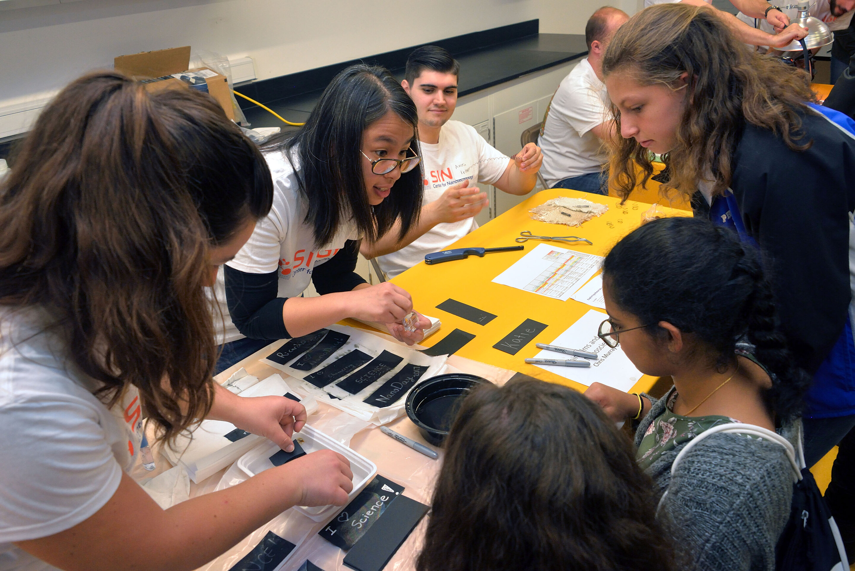 Penn students talk with elementary school students at Singh Center for Nanotechnology during Nanoday@Penn