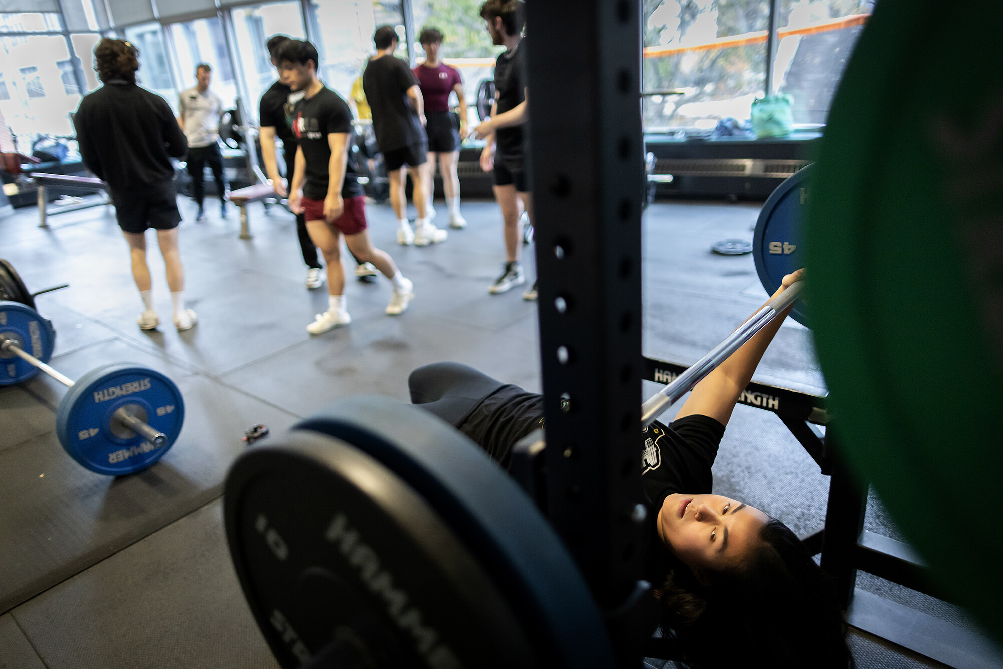 Adrienna Davis prepares to do the barbell bench press, which works your chest, shoulders, and arms.