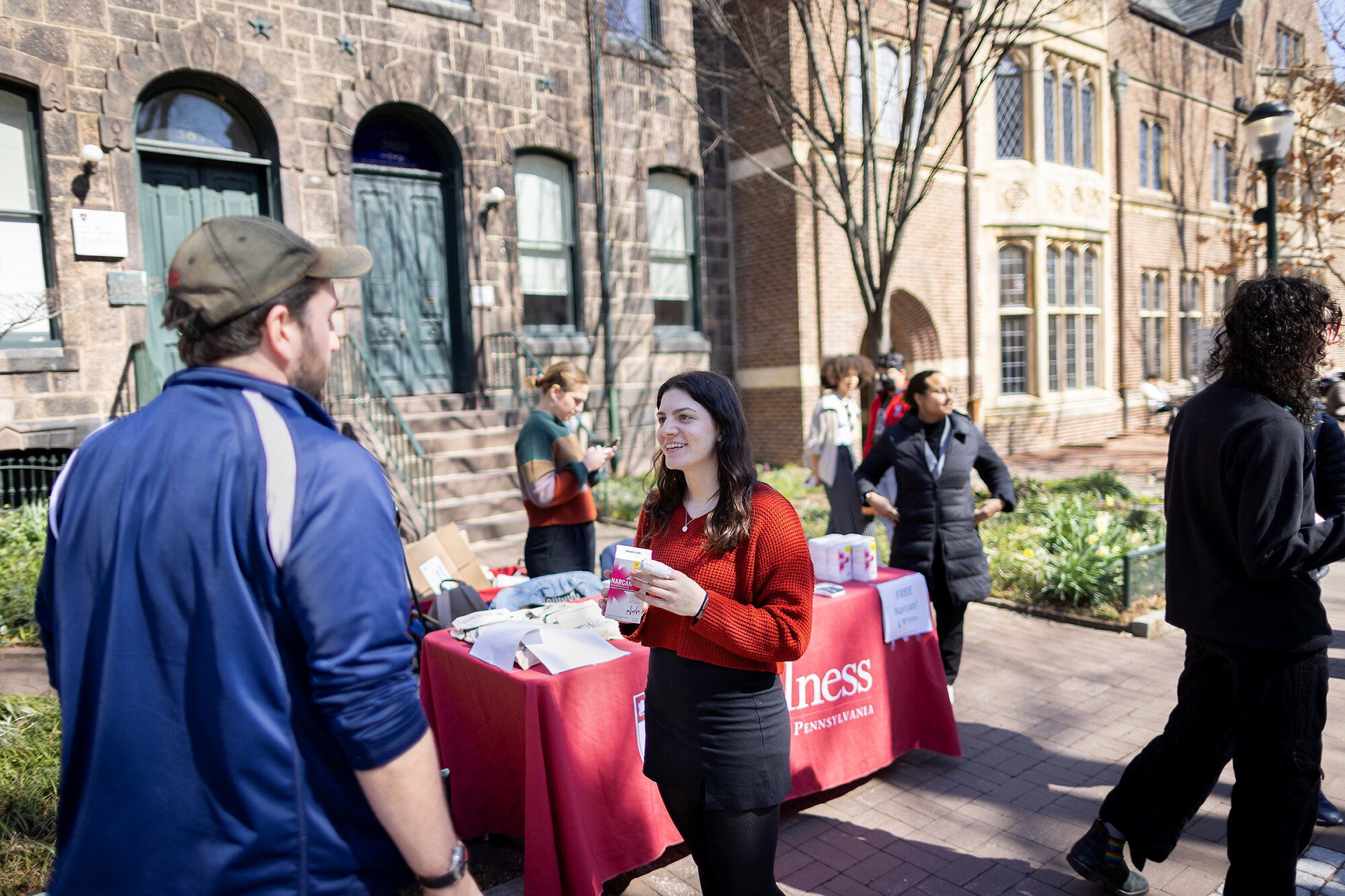 Members of MERT and Penn Wellness hand out Narcan on Locust Walk.