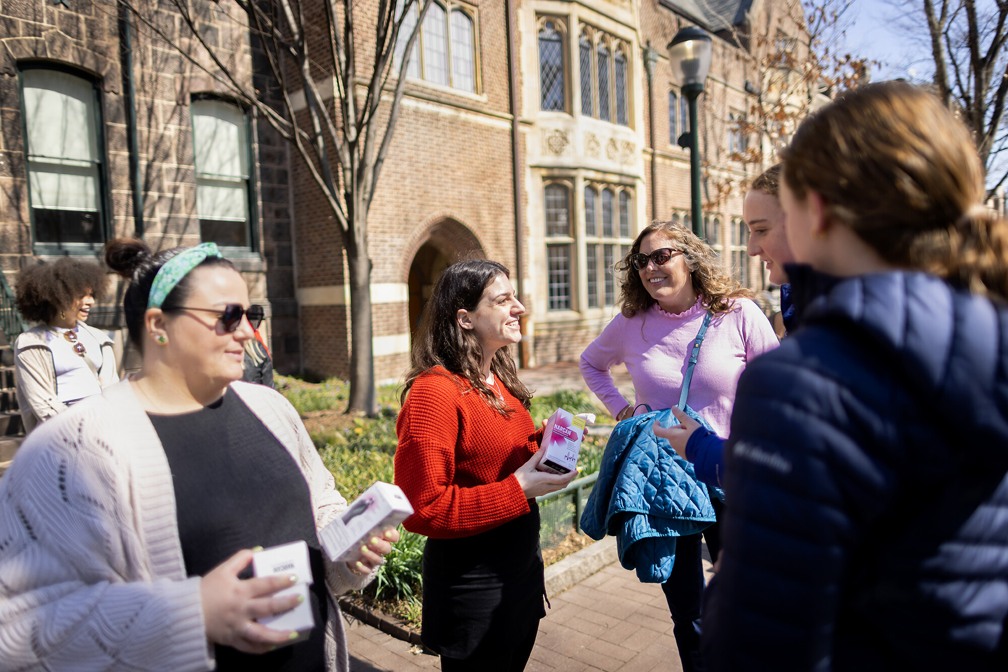 Members of Wellness at Penn and MERT hand out Narcan on Locust Walk,