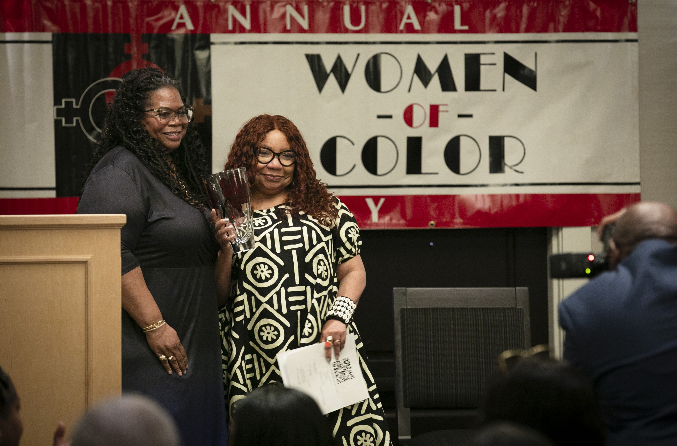 Valerie Dorsey-Allen poses with Colleen Winn, who holds her award