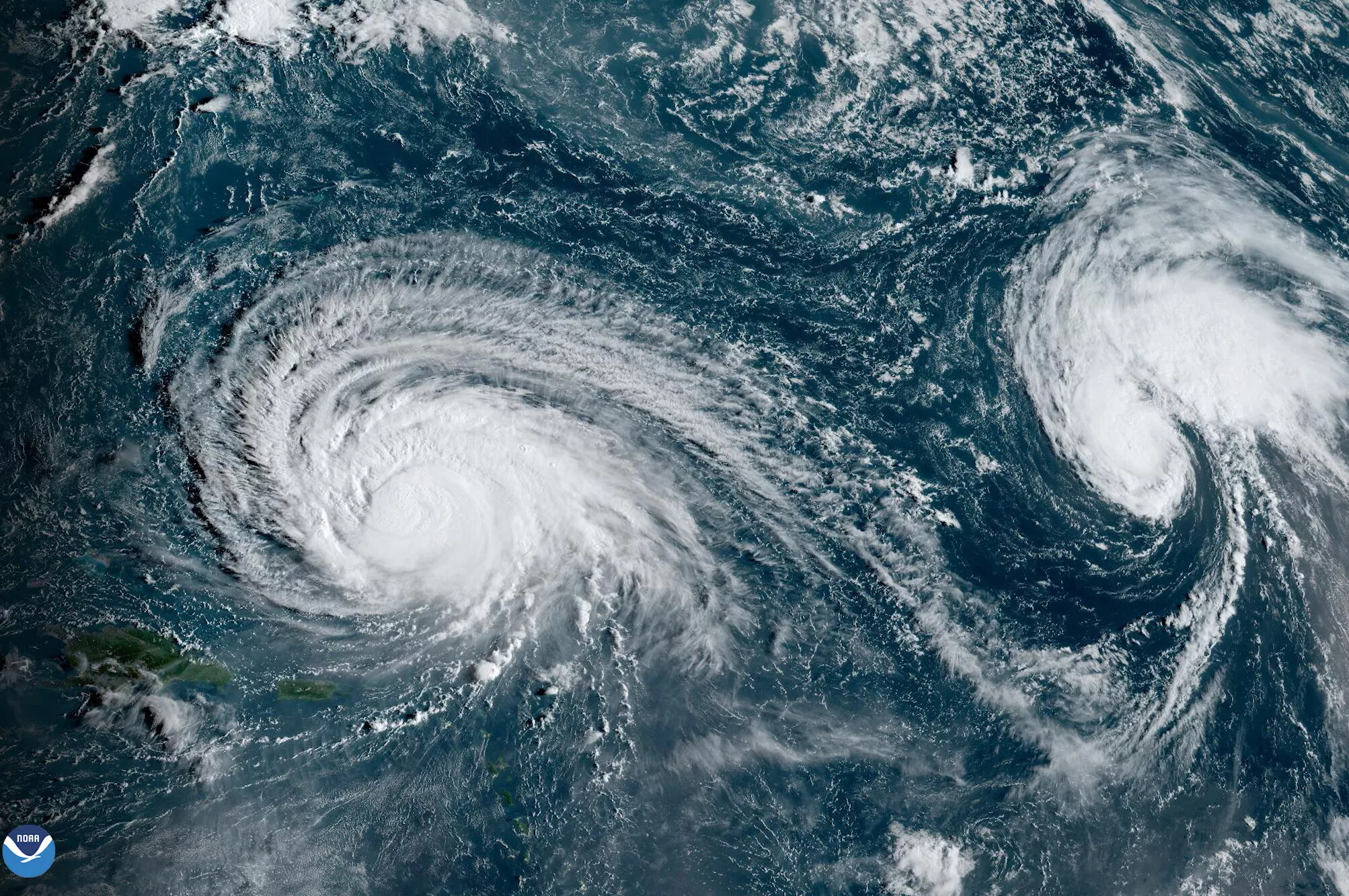 Satellite image of hurricanes forming around North America.