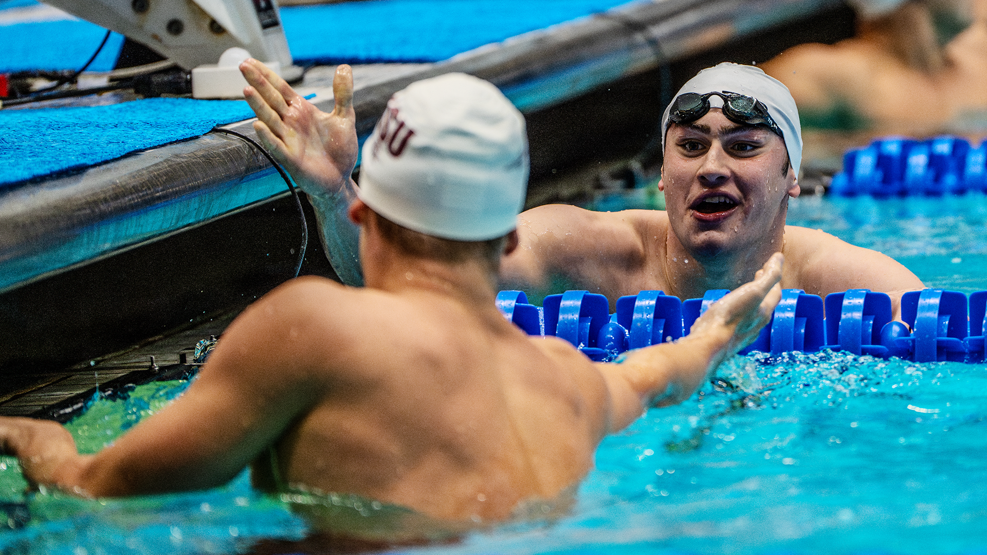 Matt Fallon slaps hands with a competitor after a race.