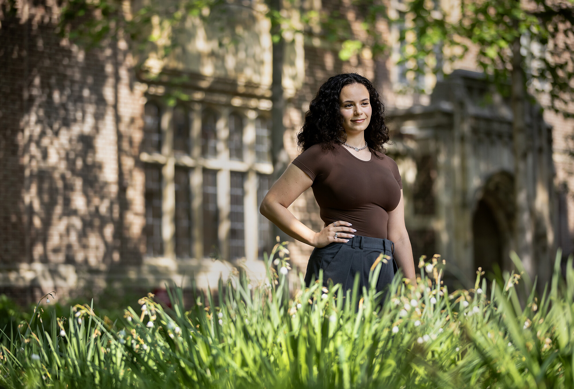 Amanda Yagerman poses with her hand on her hip outside a building on Penn's campus.