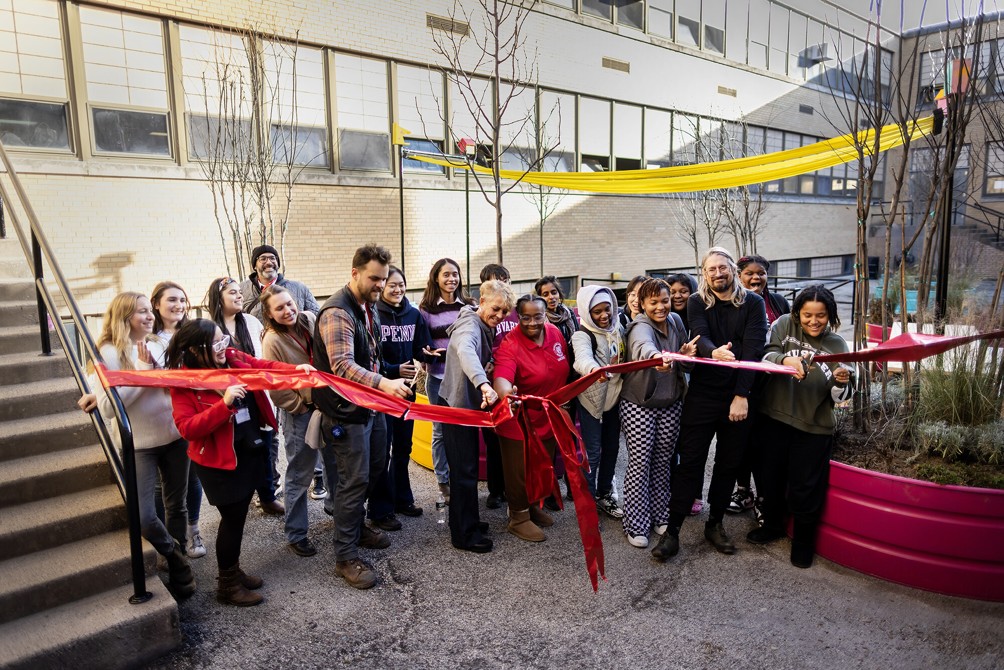 Ribbon cutting ceremony in the Breathing Room courtyard.