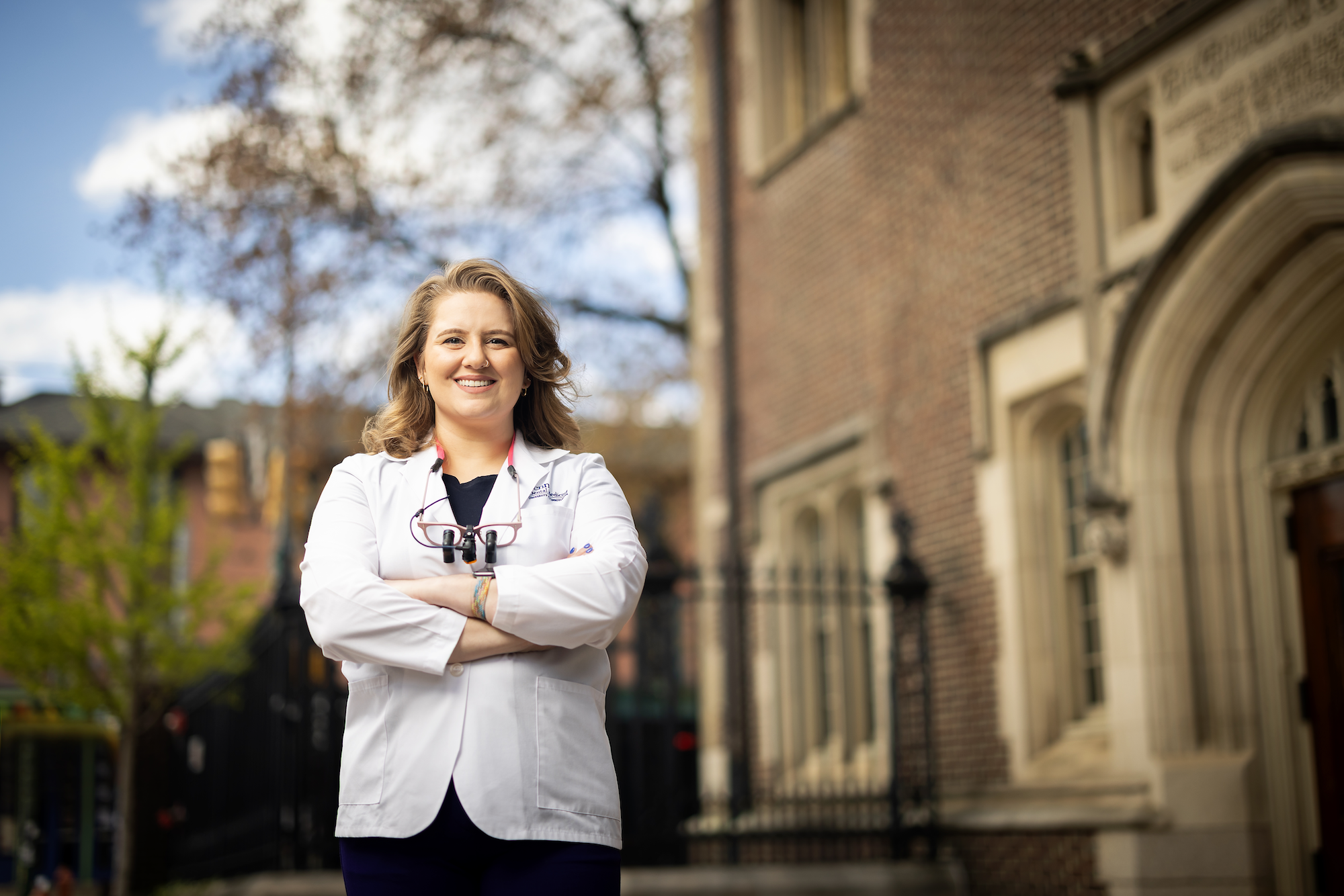 Dental student outside of university building