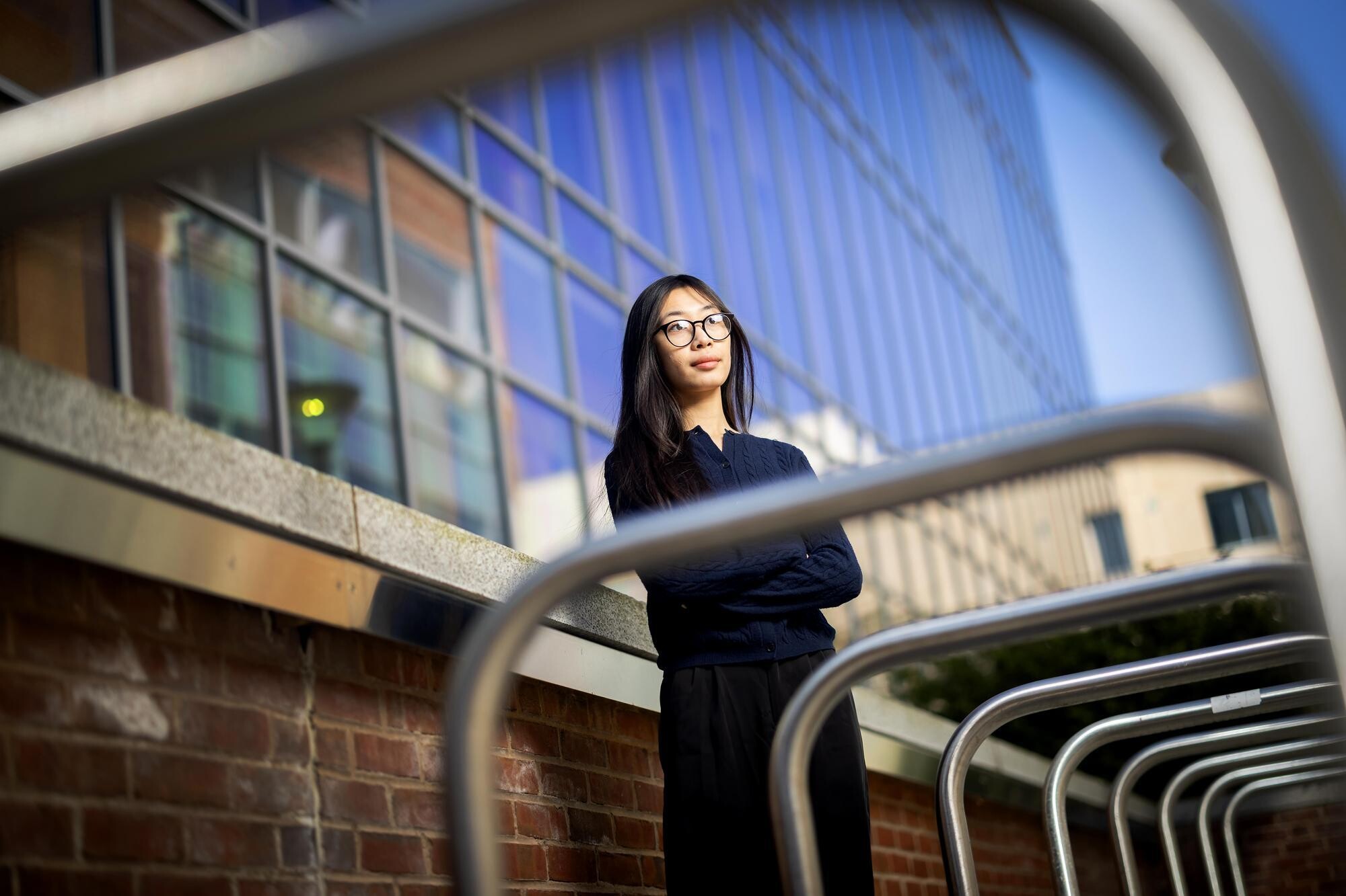 Jessica Mach standing in outside in front of a glass-windowed building