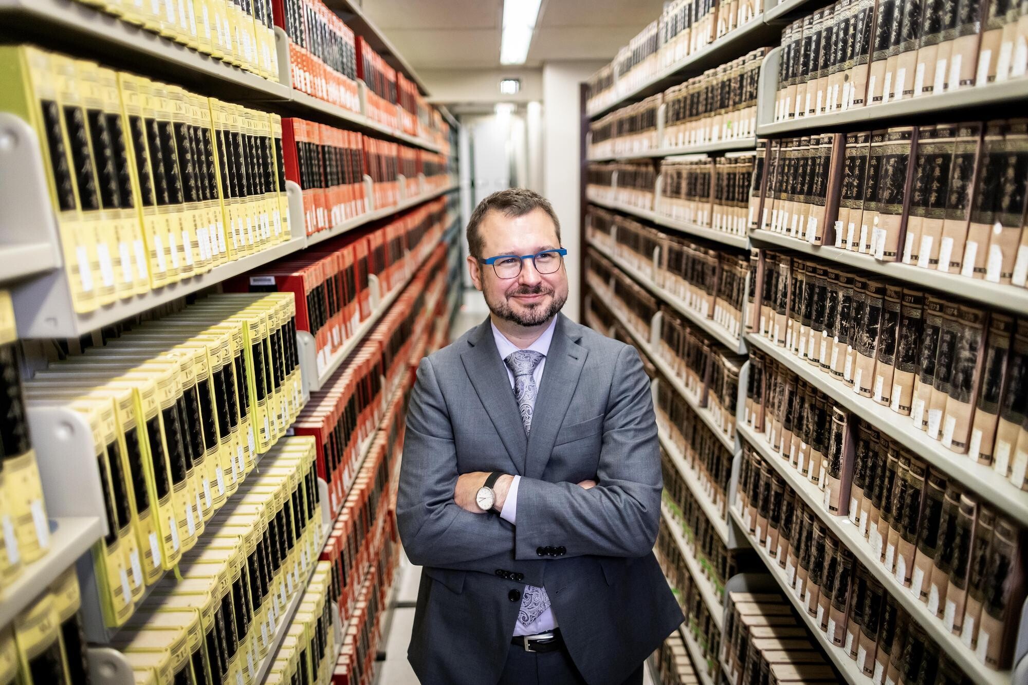 Brian Vivier amidst the stacks at Penn Libraries. 