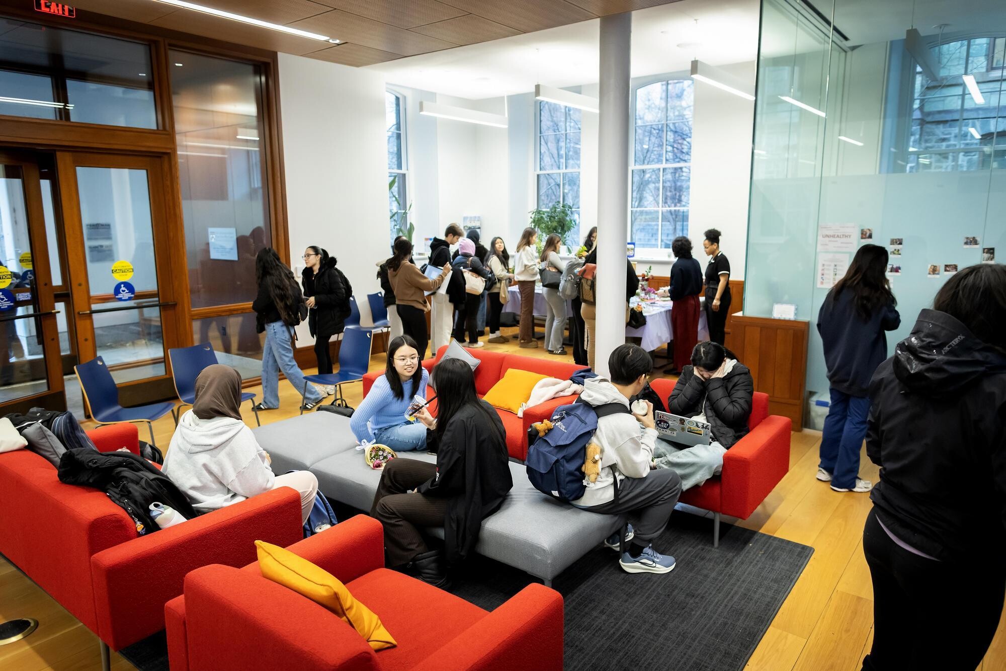 Undergraduates studying and socializing in the Penn First Plus office