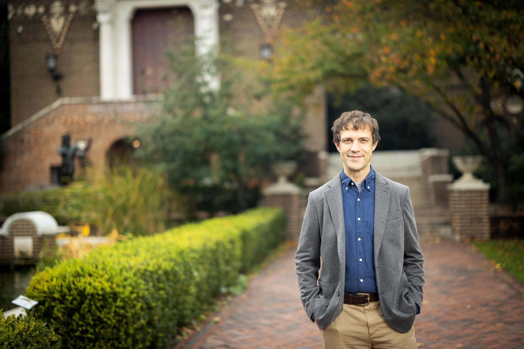 Malcolm Nelson stands in front of the Penn Museum.