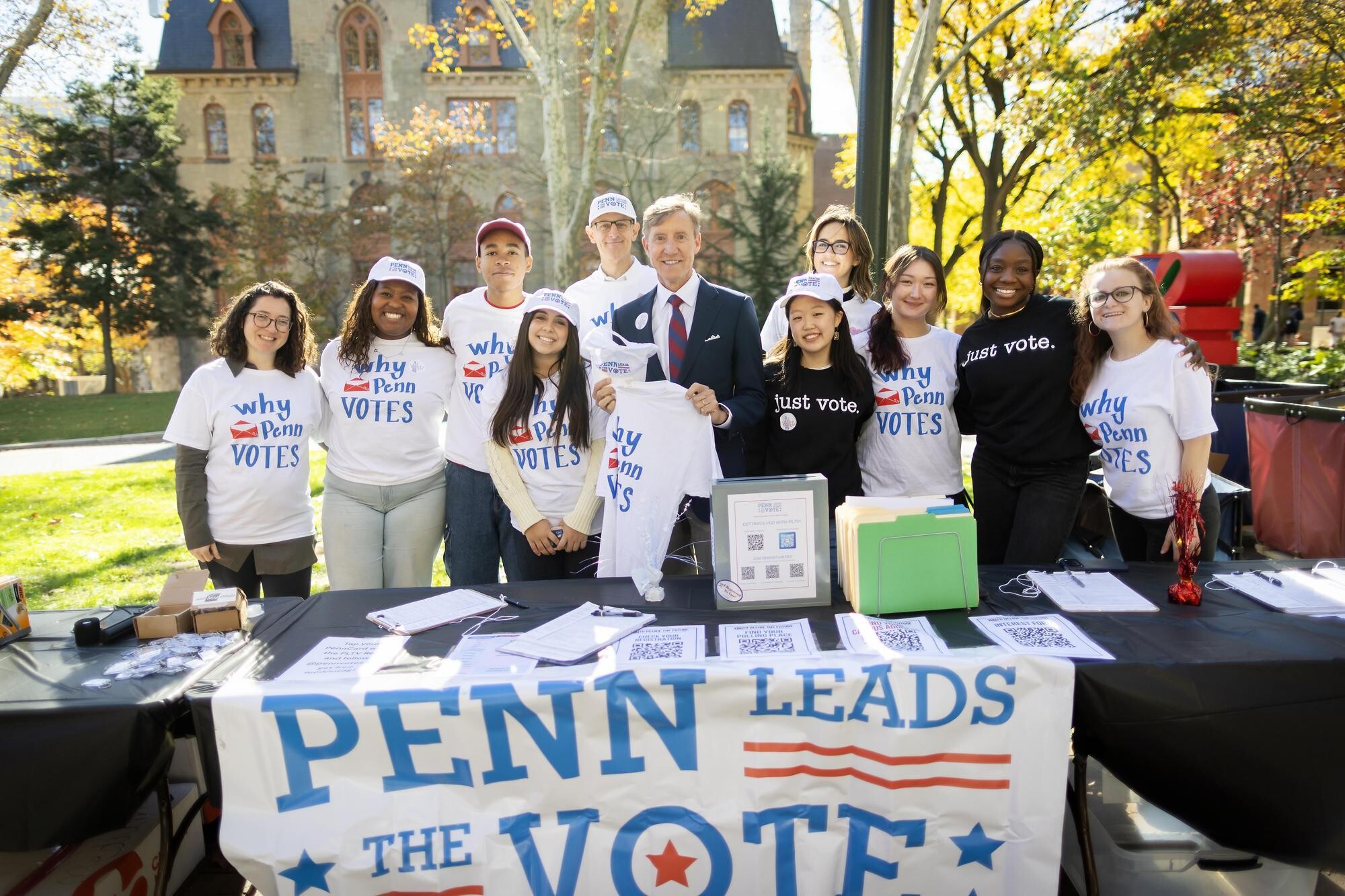 Members of PLTV with J. Larry Jameson at a PLTV table in front of College Hall.
