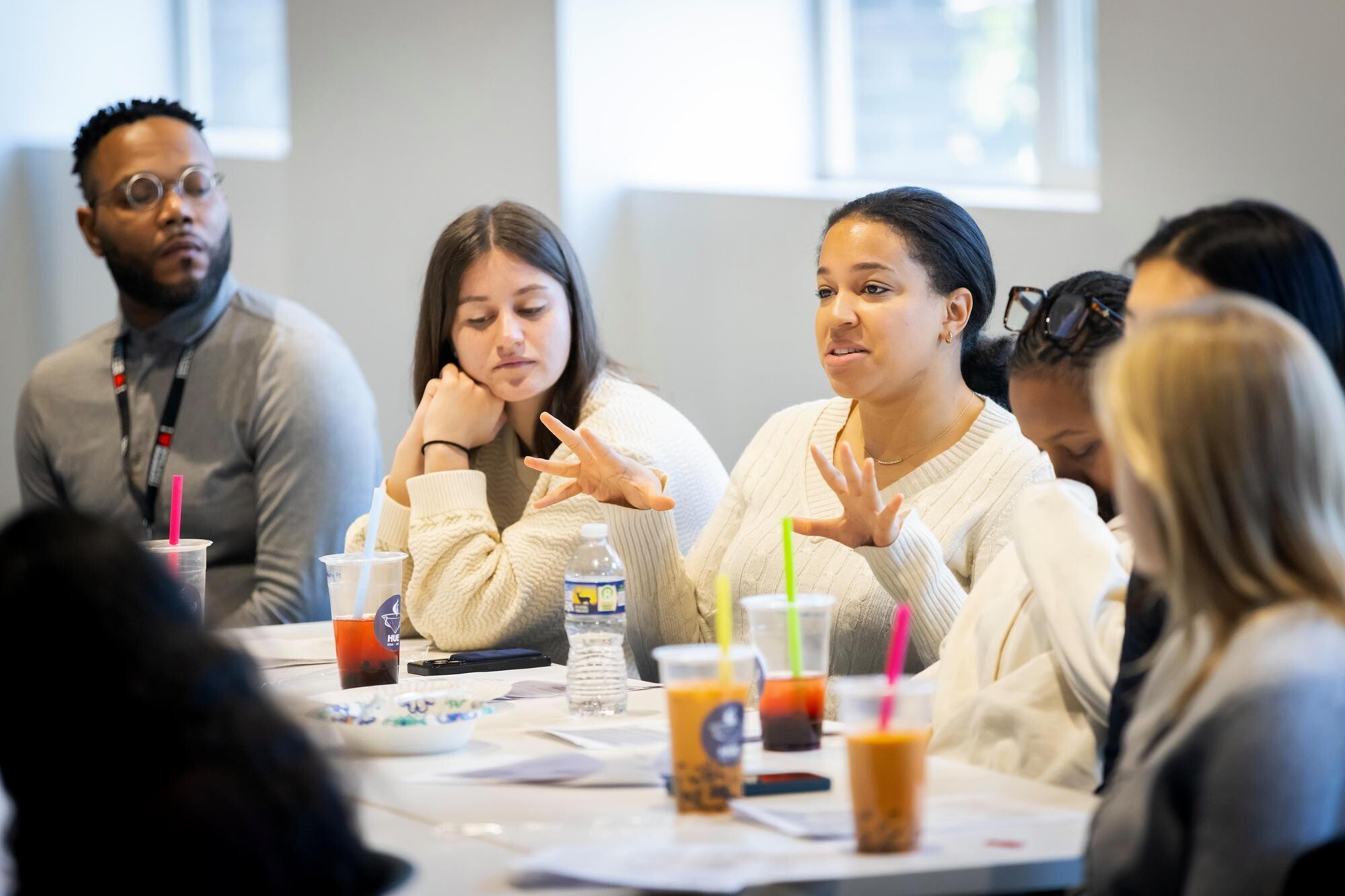 Students having a discussion at a table.