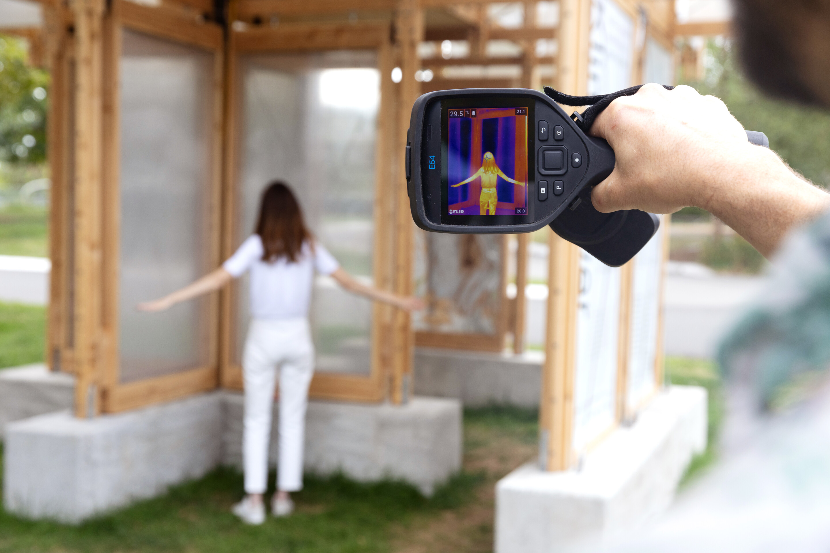 Dorit Aviv being scanned with a heat monitor by a cooling shelter.