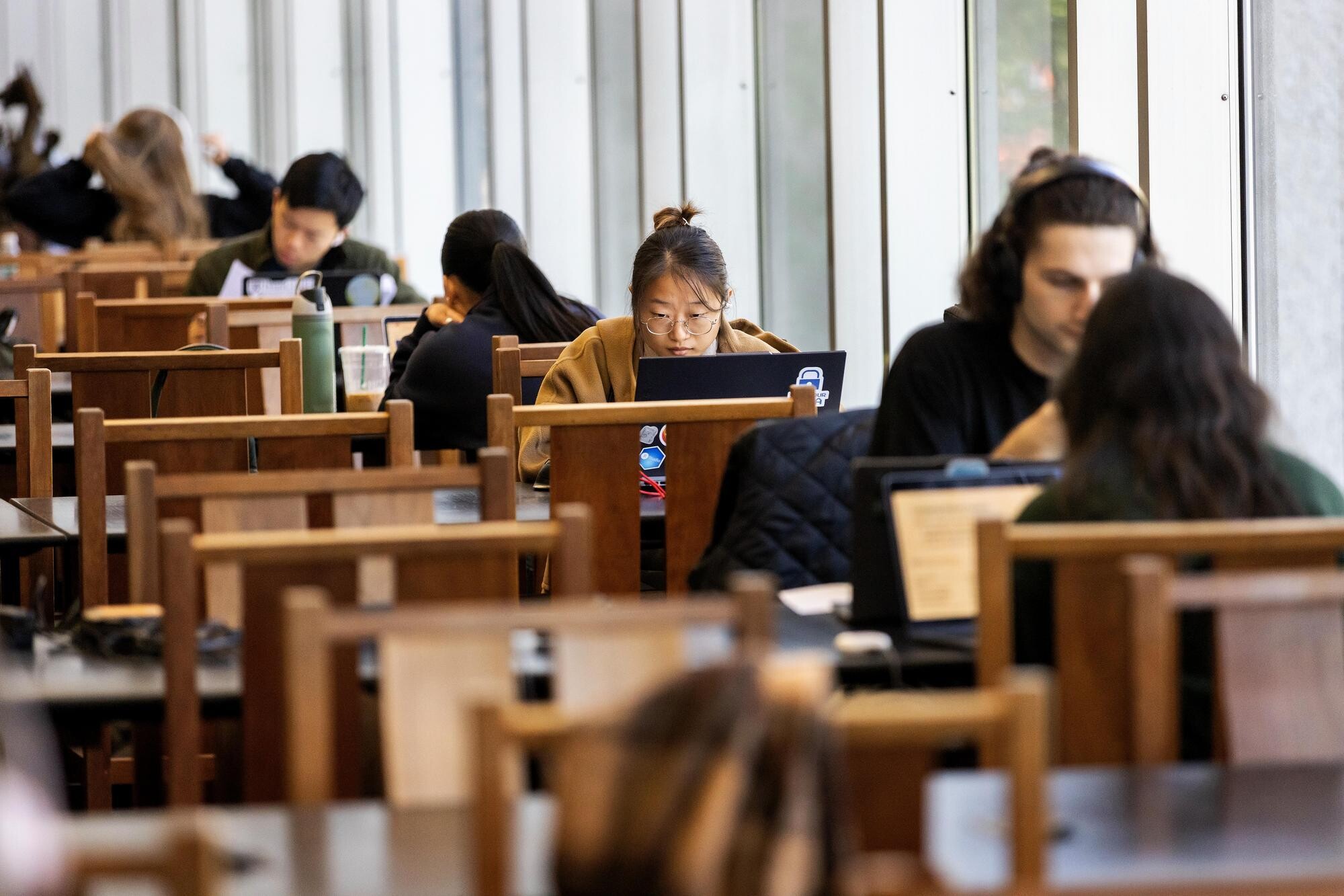 Students in Van Pelt Library studying at tables during Reading Days.