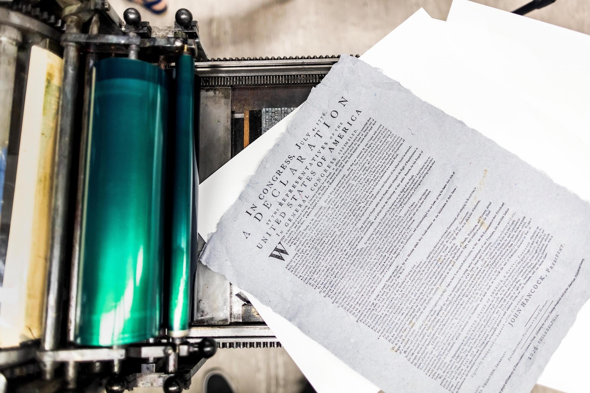  Copy of the Declaration of Independence on a printing press.
