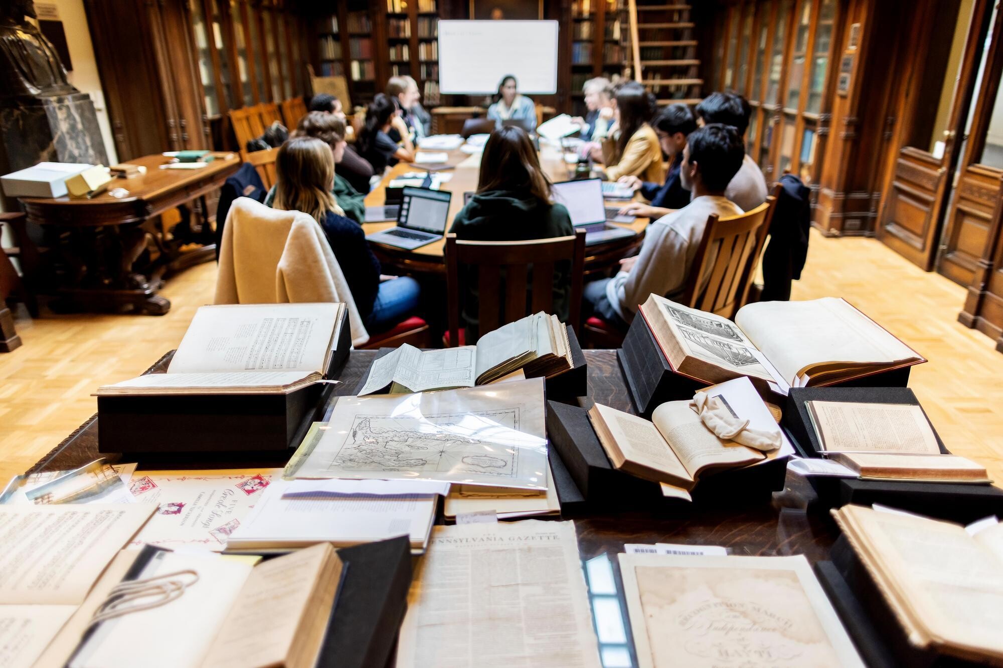 A library classroom with books from the Kislak Center on display.