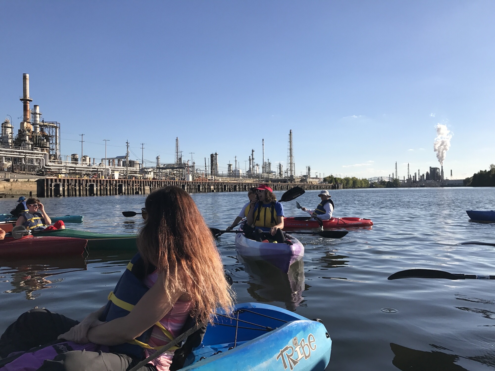 People kayak on the Schuylkill River.