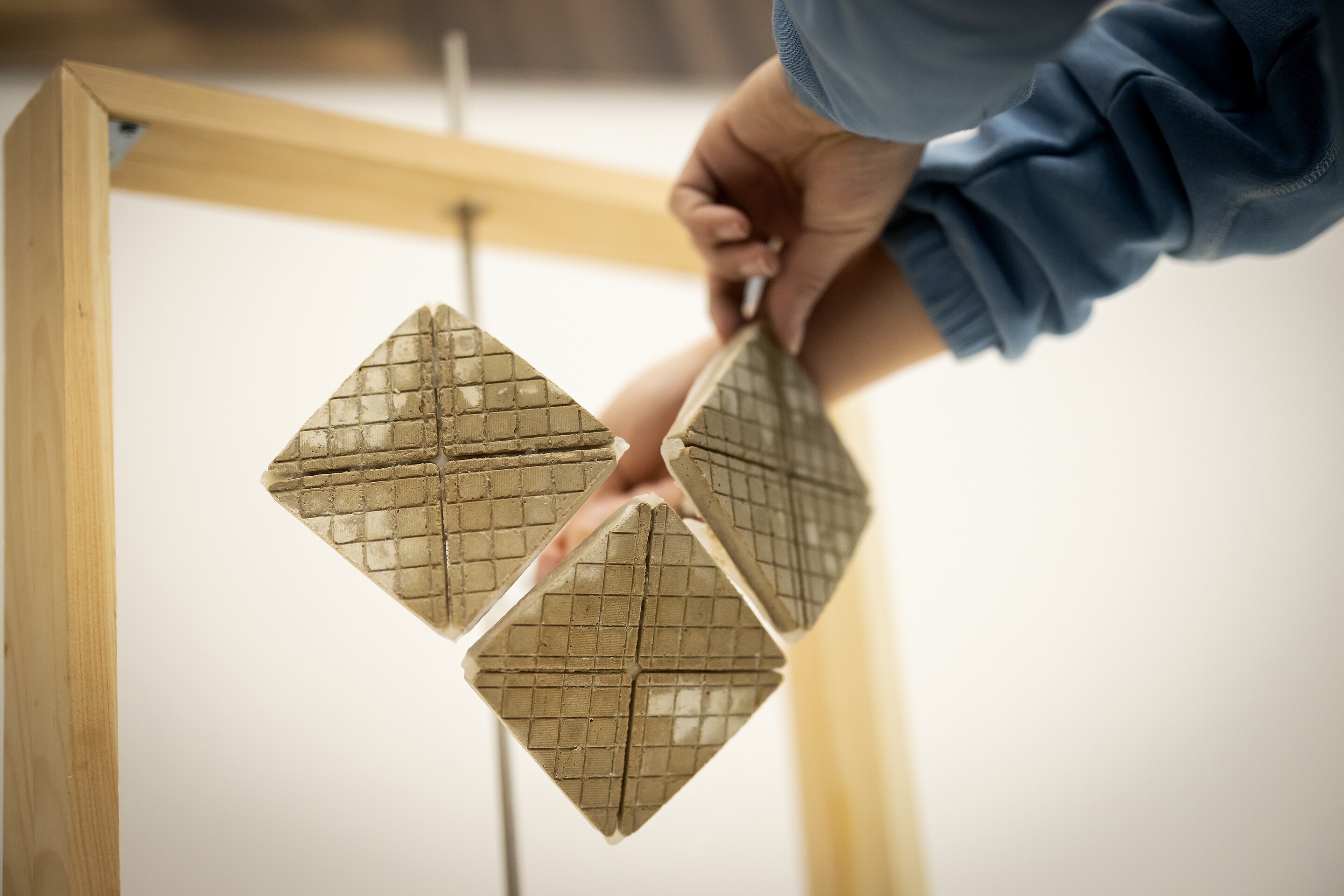 Three squares of cooling material hanging in the lab of Shu Yang.
