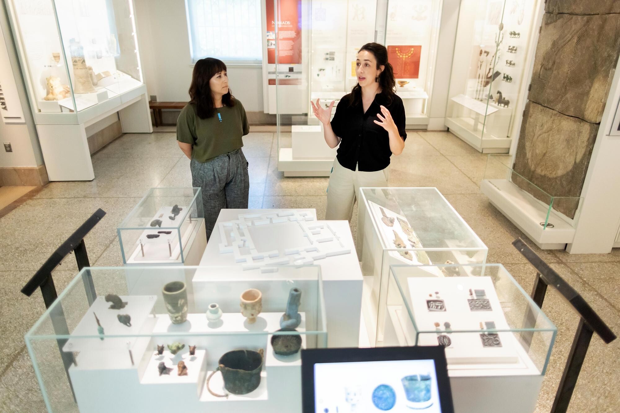 Alexis North (left) and Vanessa Workman in the Middle East Gallery at the Penn Museum.