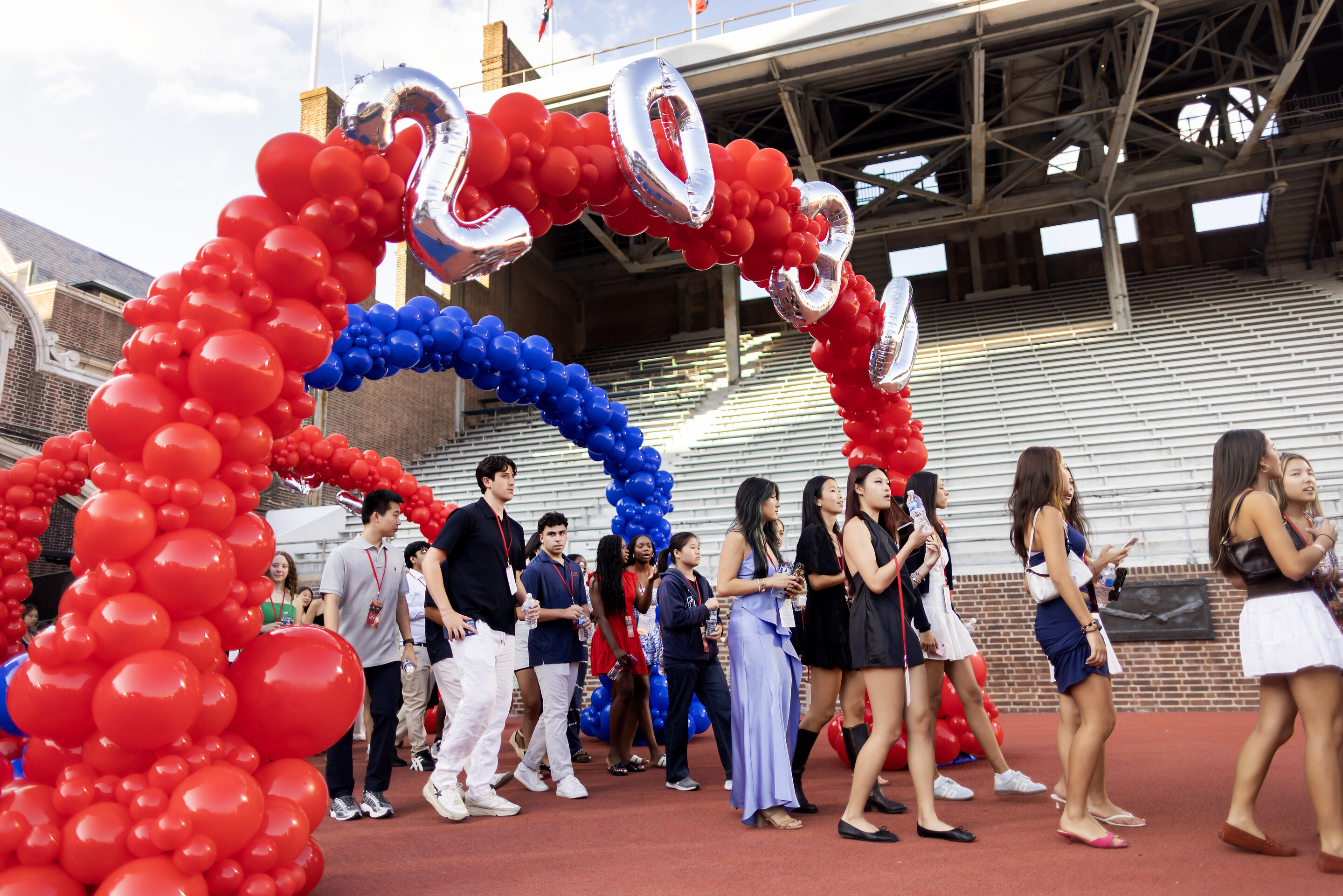 The Class of 2030 walking onto Franklin Field for Convocation.