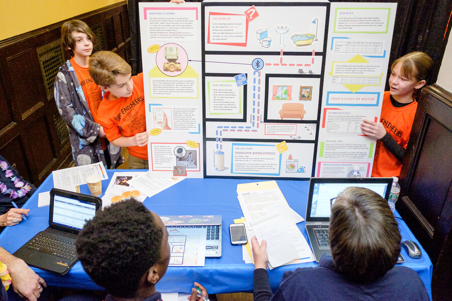 After completing field tasks with their robot, the middle school students have to present a research project