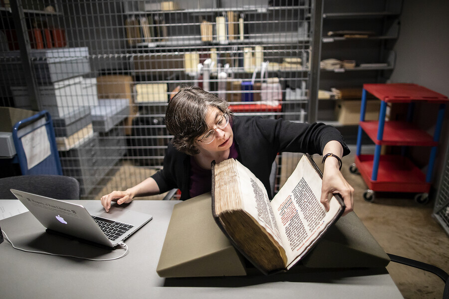 bibliophilly, inspecting manuscript