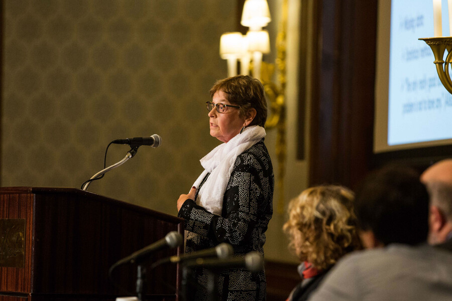 University of Pennsylvania sociologist Irma Elo stands at a podium to give her talk. 