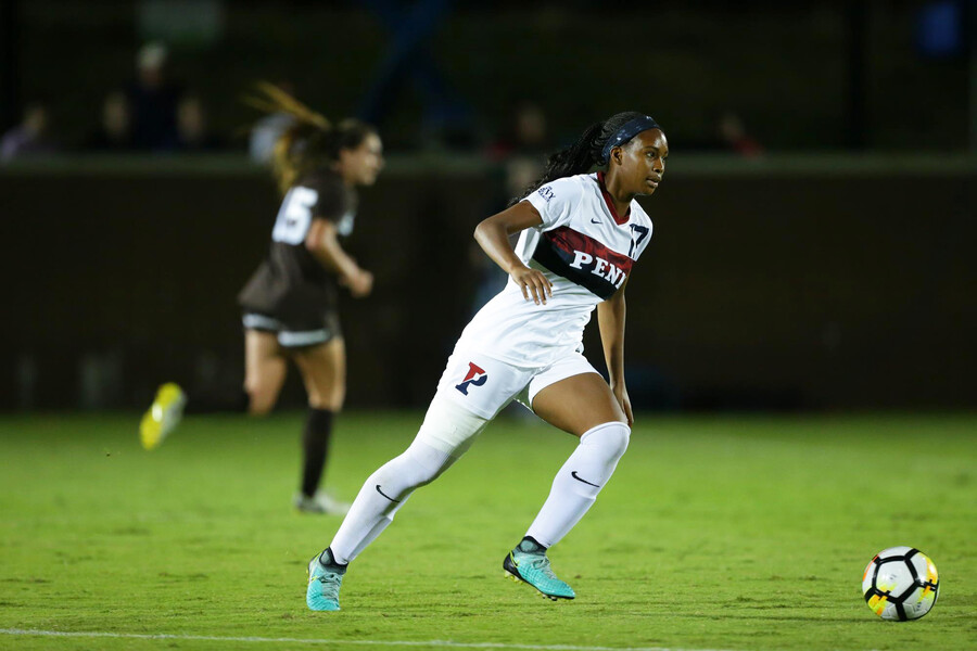 Camillia dribbles the ball down the field