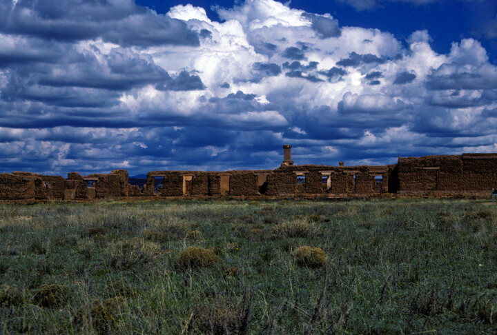 Fort Union adobe ruins with blue sky in distance
