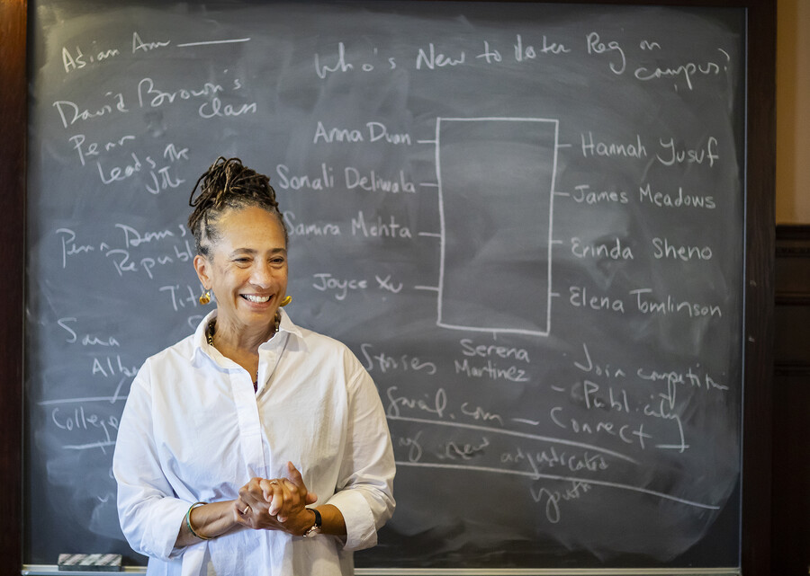 Lorene Cary standing in front of a chalkboard