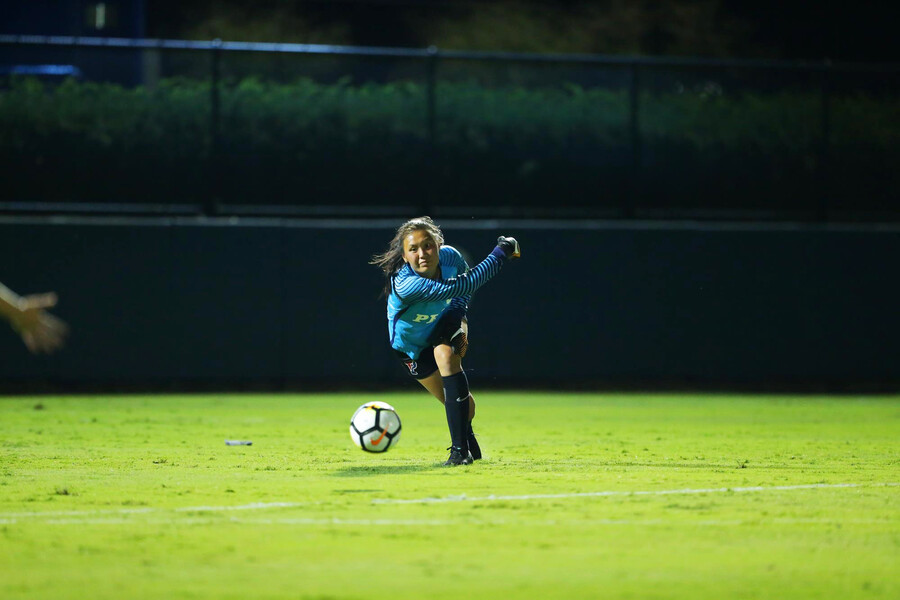 Qu clears the ball during a game