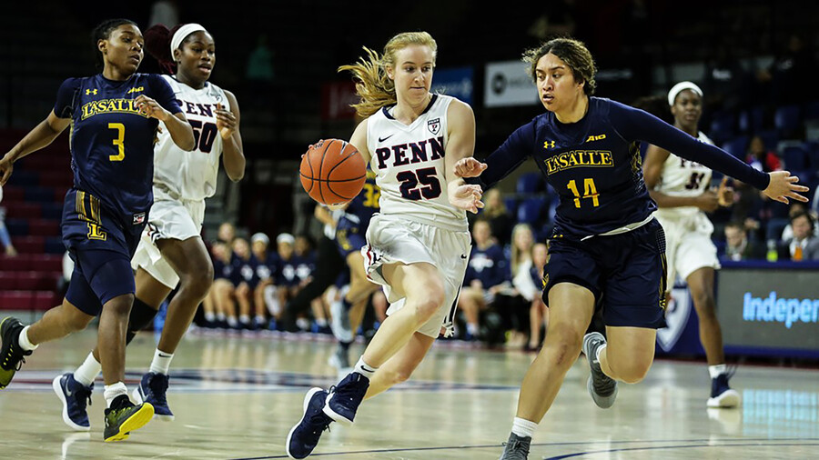 Ashley Russell dribbles to the basketball against La Salle