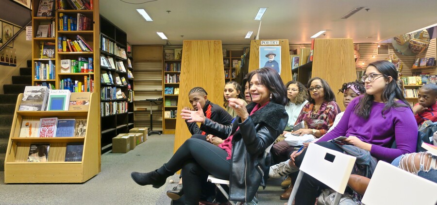 a person in the audience asks a question during the Q&A portion of the event