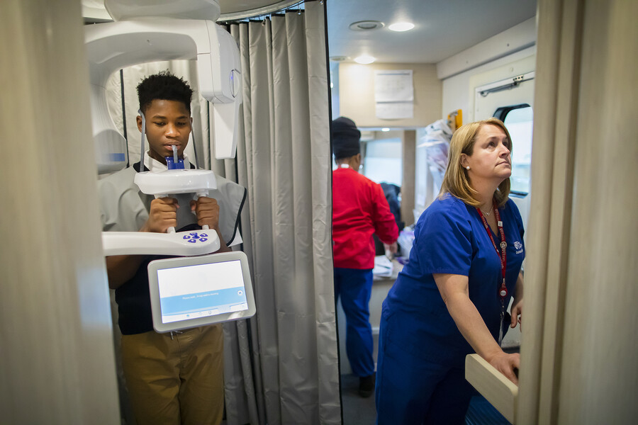 dental patient gets xrays taken on smiles bus