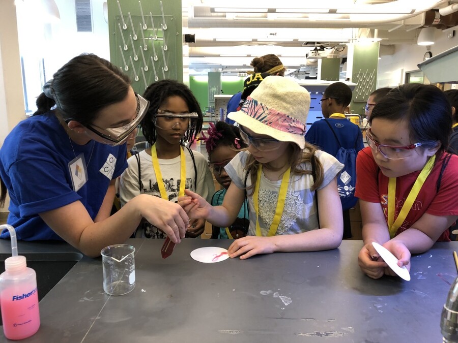 students in a lab looking at filter paper
