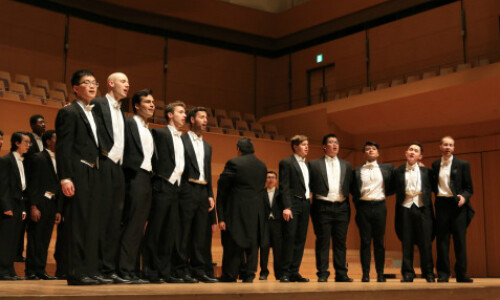 Students on stage singing.