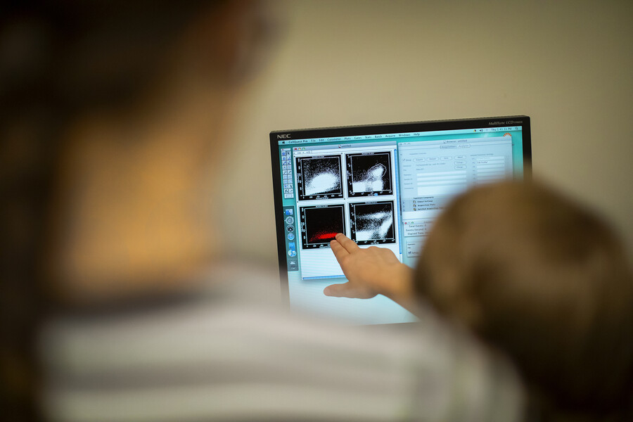 pointing at a computer in the canine lab