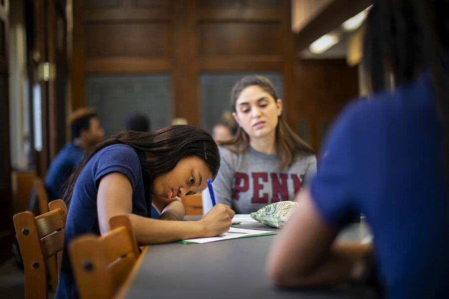 a student writing during a tutoring session