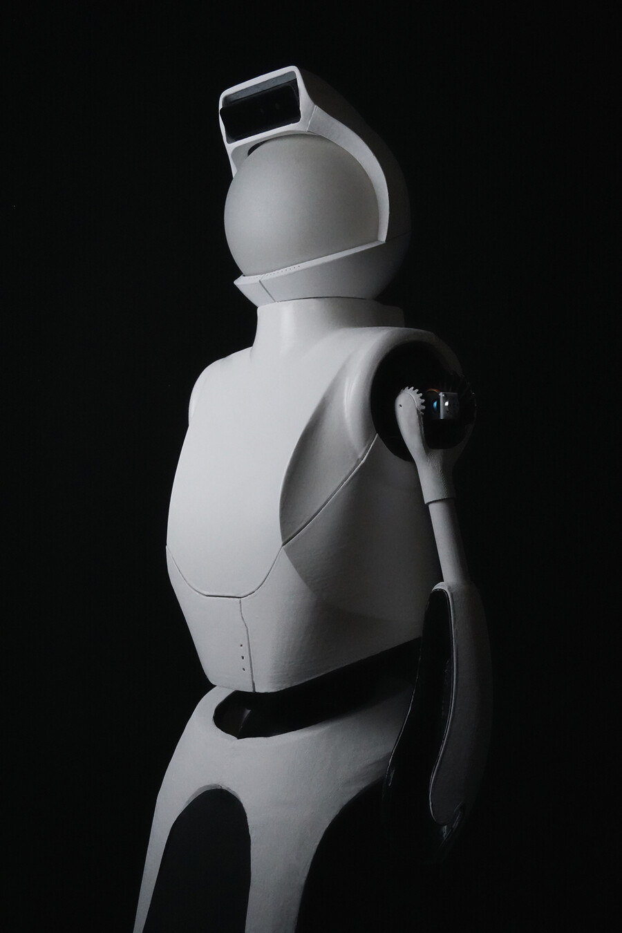 Quori the robot standing in dramatic lighting