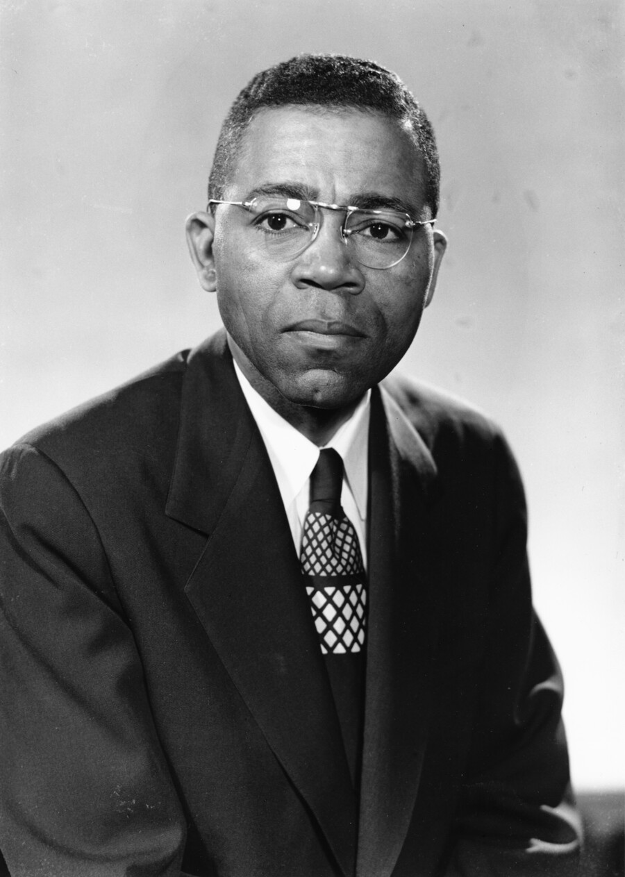 William Fontaine poses for a photo, which is in black and white.