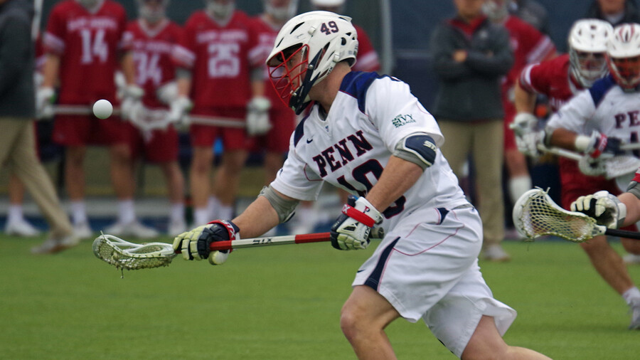 the ball hovering above Gallagher's stick on the field