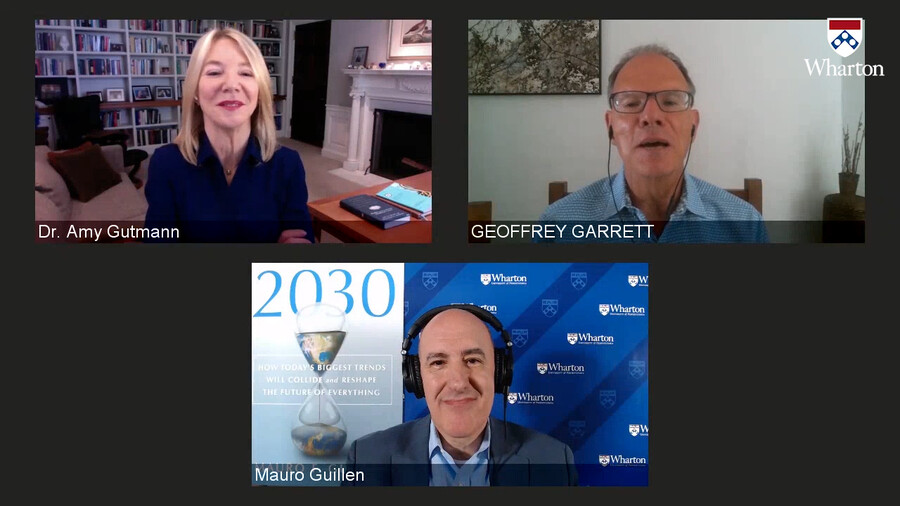 Screen shot of a Zoom screen with Amy Gutmann, Geoffrey Garrett and Mauro Guillen