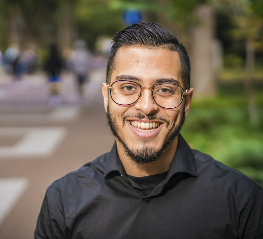 Portrait of smiling man with beard and glasses